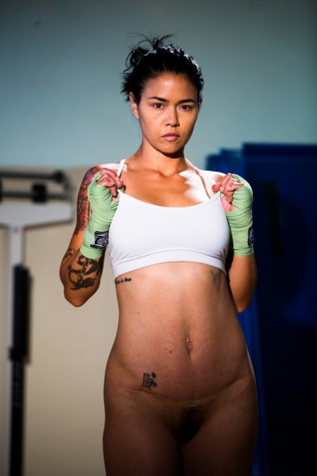 Tattooed Asian fighter Dana Vespoli highlights her nice ass in the nude