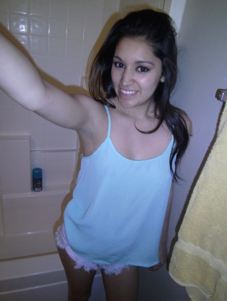 Petite amateur brunette cutie Selena takes a selfie of her hot tits and ass 33257264