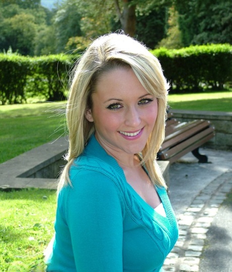 Blonde chick shows off nylon covered legs at the park in her new black heels