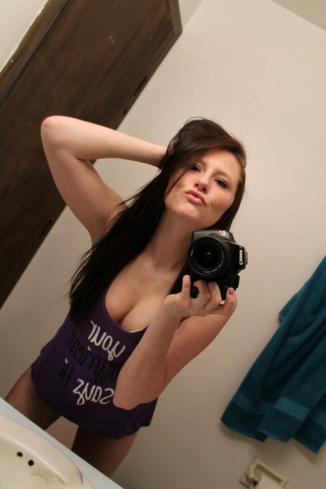 Amateur chick Freckles 18 sticks out her tongue while taking mirror selfies 16512827