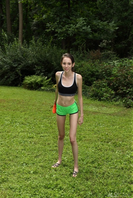 Slender brunette teen Aria Haze dildos her tight pussy atop bean bag toss 45157580