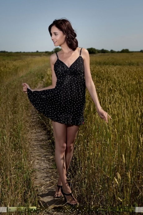 Petite brunette teen Sabrina G wanders naked in a farmer's field 56394497