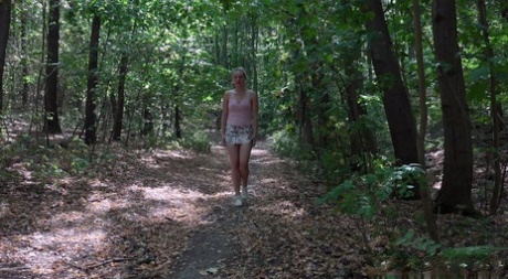 Caucasian girl Bianca Ferrero takes a piss while walking through a forest 43478495