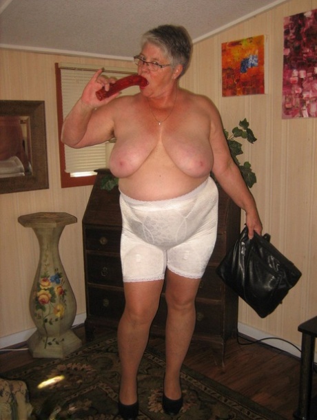 Old amateur Girdle Goddess plays with a sex toy while disrobing by herself 28269361