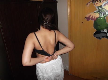 Pretty Indian girl stands naked after undressing in her bedroom 10306637