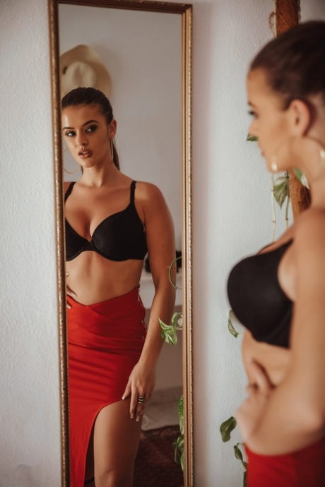 Hot brunette Brook Wright unzips a red skirt to pose nude afore a mirror 11107267
