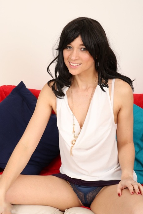 Mature British woman gets naked on a sofa while wearing high-heeled shoes 13427292