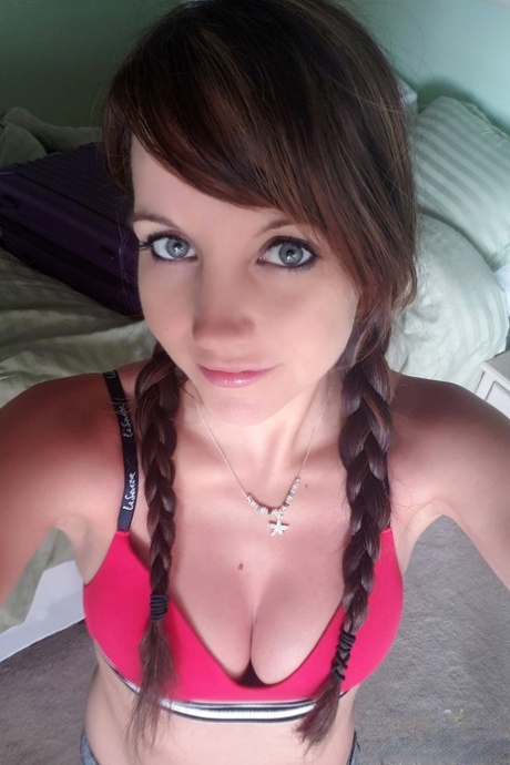 Thin teen Andi Land tugs on braided pigtails before showing her tits and pussy 44424606