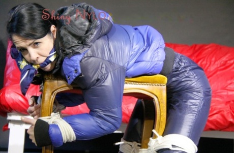 Dark haired chick is tied to a footstool while gagged in a winter coat 59904152