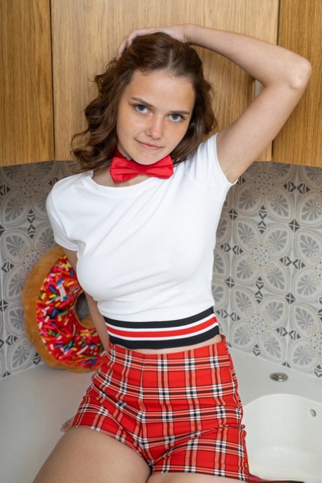 Young looking girl Marciana proudly shows her pert tits and twat in OTK socks 54957037