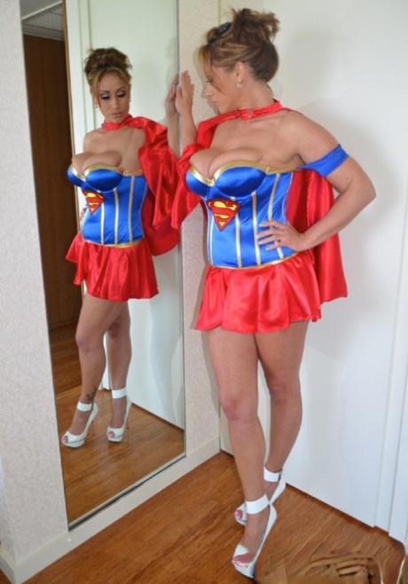 Sexy MILF Eva Notty sports cum on her tits while removing a Superman costume 69097089
