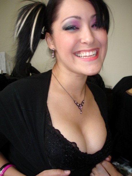 Cute Asian girl strips to a black bra and panty set in pigtails 70615986