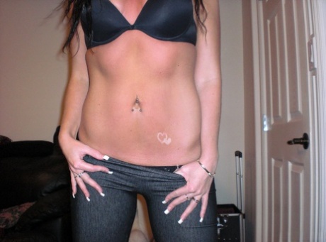 Dark haired amateur reveals her ass crack while disrobing to a bra and thong 26238883