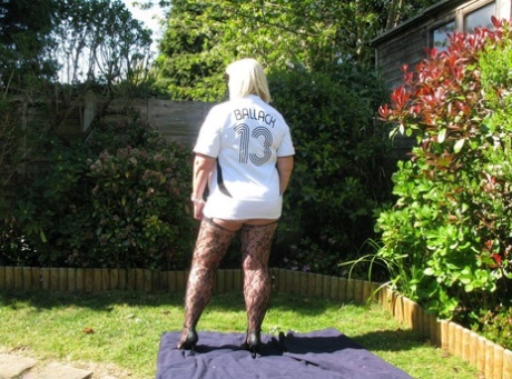 Mature blonde fatty Chrissy Uk gets naked in nylons in her backyard 52634392