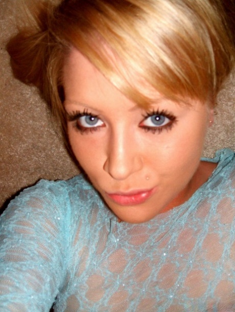 Blonde amateur takes teasing self shots while wearing a sheer top 88236173