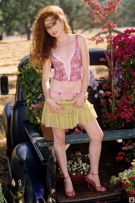 Natural redhead Scarlett Keegan removes skirt to pose naked in heels outdoors 57054387