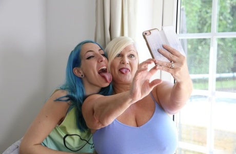 Older and younger lesbians Lacey Starr & Liz Rainbow take a selfie before sex 15138287