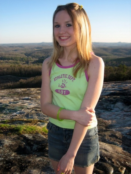 Cute teen exposes her small tits and ass while out in nature 63834455
