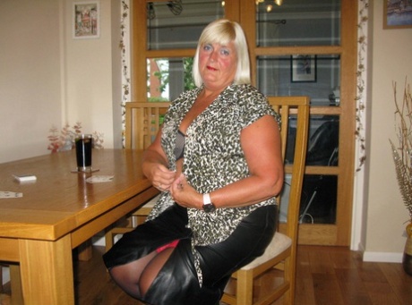 Mature blonde BBW Chrissy Uk loses her clothing while playing strip poker 27546485