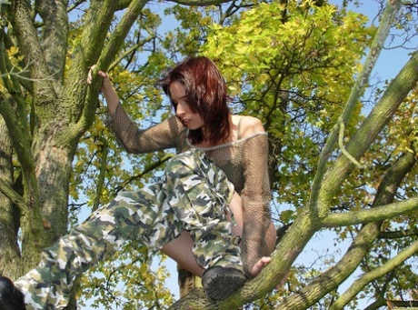 Amateur model Vivian pulls down camo pants while up in a tree 40981222