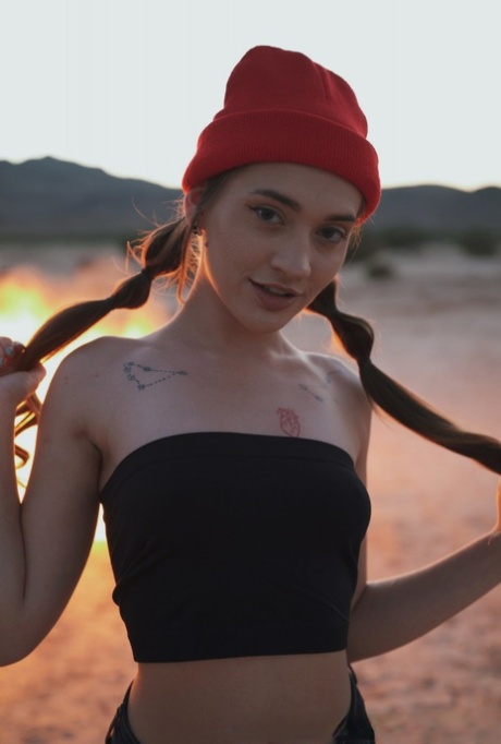 Sera Ryder plays with her pigtails near a bonfire before having sex 60930259
