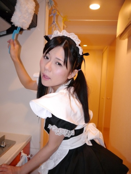 Japanese maid Mai Araki gives a BJ before being fitted with a sex toy 88322408