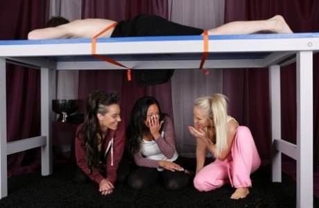 Three British women suck off a cock underneath a milking table 33663966