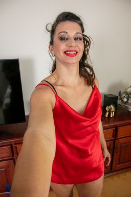 Brunette woman Genia goes topless while giving her stepson a BJ and handjob 99548464