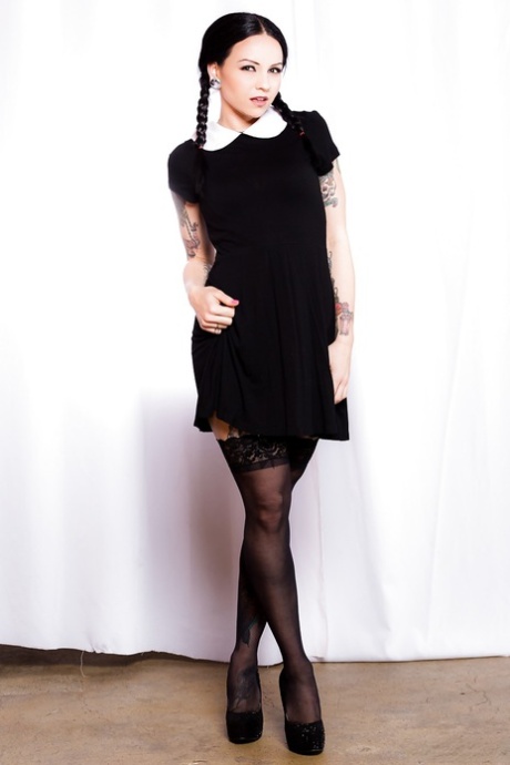 Fetish model Necro Nicki posing in stockings and garters with hair in pigtails 91749653