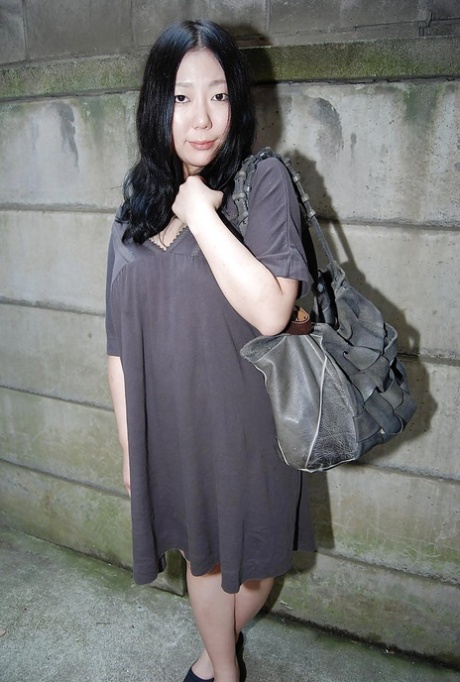 Well-stacked asian lassie undressing and exposing her juicy twat in close up 99300201
