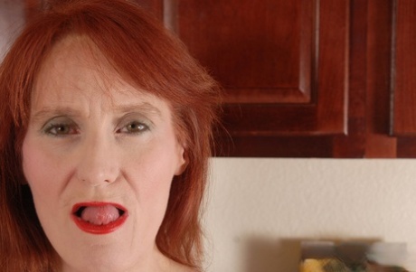 Redhead granny Debra is lying naked on the floor and masturbating 41961847