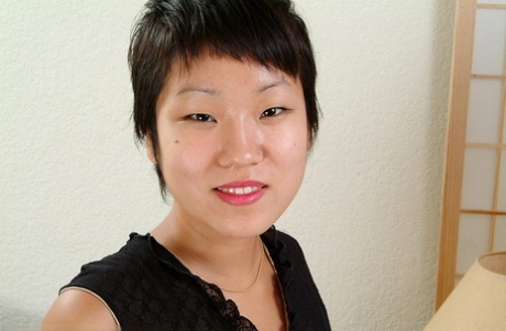 Close up of petite Oriental chick Vicky revealing nice tits and beaver 26858226