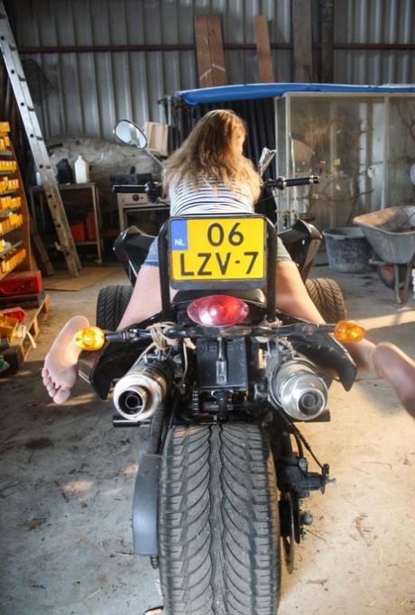 Blonde female DD is left ball gagged and rope bound atop a 3 wheeler 97481807