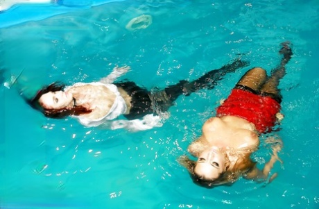 Gina Killmer & Kety Pearl have some clothed lesbian fun in the pool 64009358